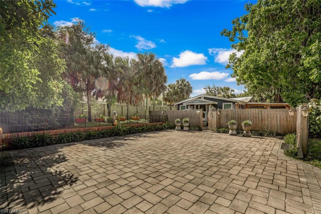 9520 Corkscrew Road Estero, FL 33928 - Photo 3 of 27 tons of parking in front of the home.