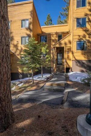 a view of a brick house with many windows
