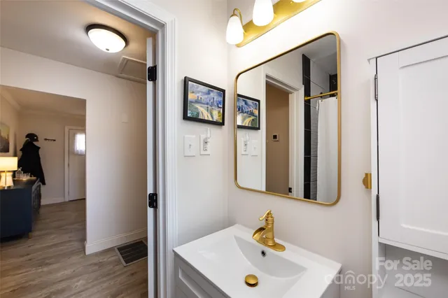 a bathroom with a sink and mirror