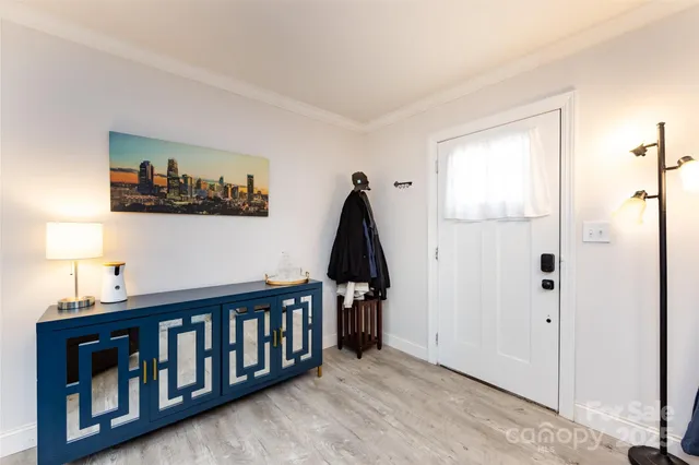 a view of hallway with wooden floor