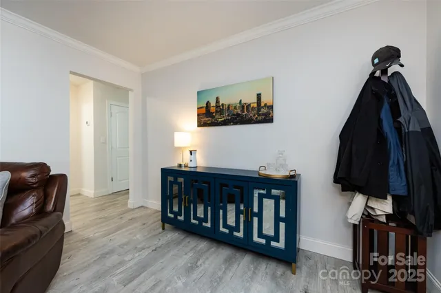 a view of a livingroom with furniture and clothes