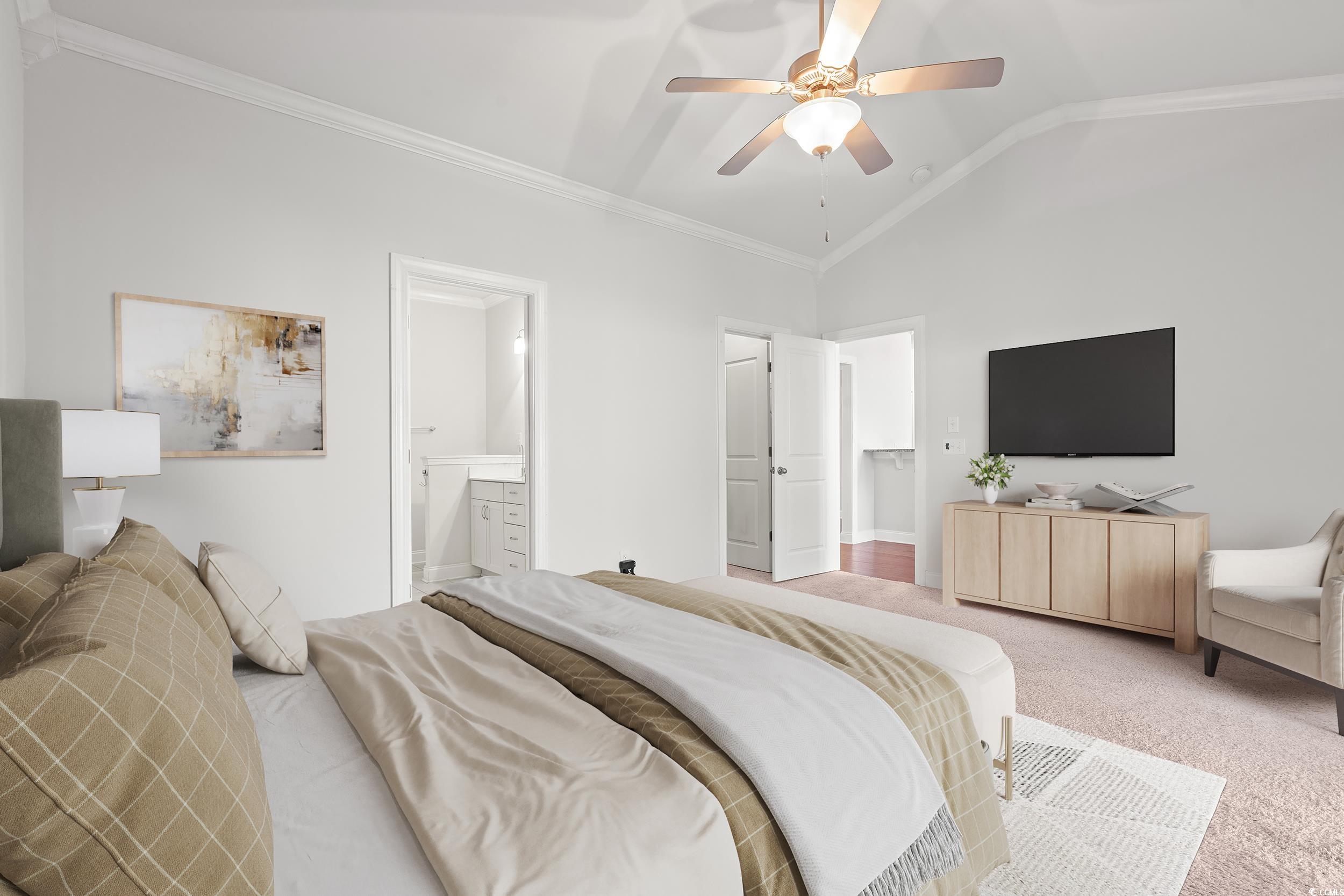 135 Parmelee Drive, Unit C Murrells Inlet, SC 29576 - Photo 16 of 37 Bedroom with crown molding, carpet flooring, lofted ceiling, a ceiling fan, and connected bathroom