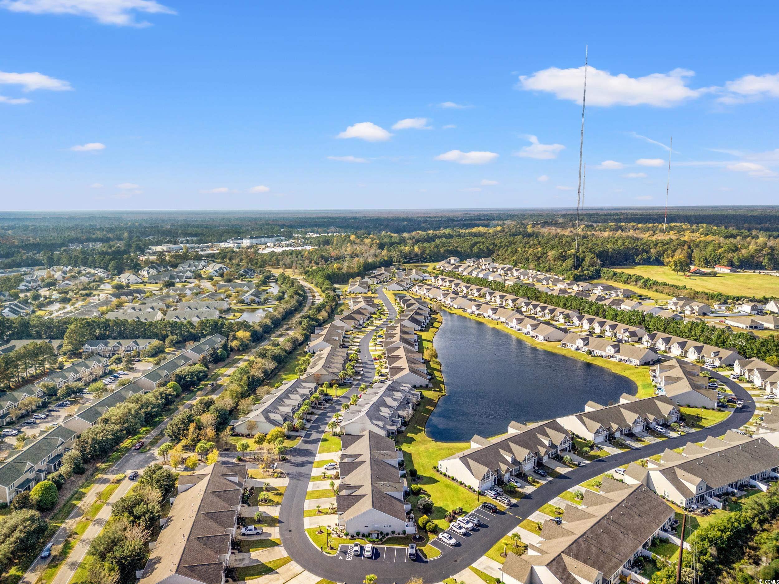 135 Parmelee Drive, Unit C Murrells Inlet, SC 29576 - Photo 35 of 37 Aerial view of residential area featuring a nearby body of water