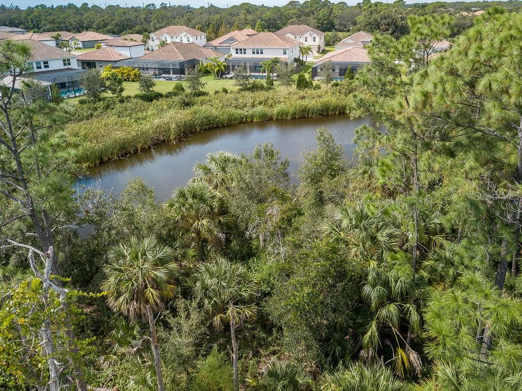 Quarter Horse Road Sarasota, FL 34241 - Photo 7 of 18 an aerial view of residential houses with outdoor space and lake view