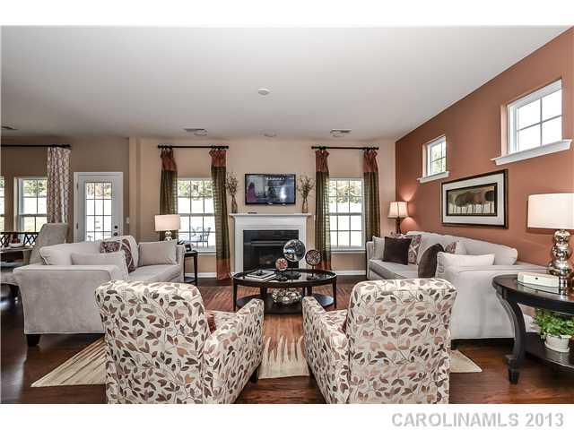 78114 Rillstone Drive, Unit 206 Lancaster, SC 29720 - Photo 3 of 16 a living room with fireplace furniture and a large window
