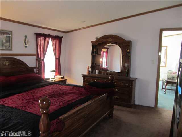 1853 Amostown Road Sandy Ridge, NC 27046 - Photo 14 of 16 Master Bedroom.