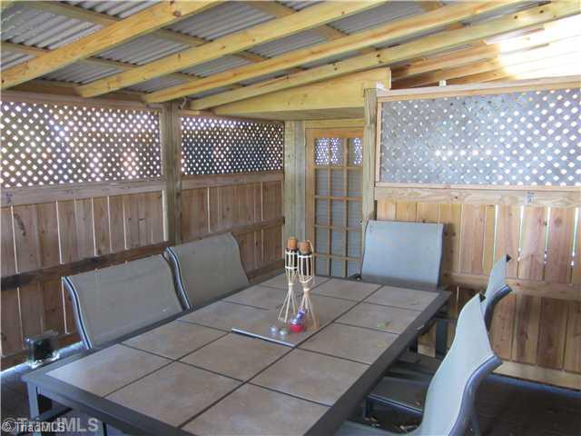 1853 Amostown Road Sandy Ridge, NC 27046 - Photo 16 of 16 Patio/Deck. Covered Porch