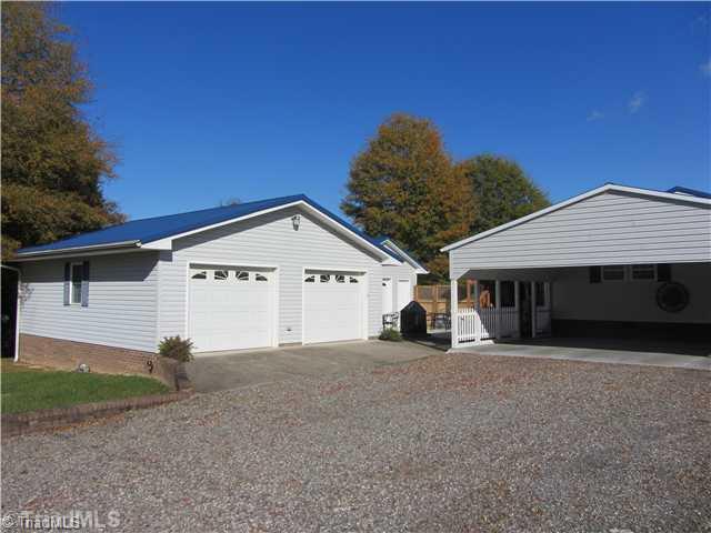 1853 Amostown Road Sandy Ridge, NC 27046 - Photo 3 of 16 Parking Lot/Garage. 24 X 32ft Double garage, 16X16ft Sg garage, Db carport