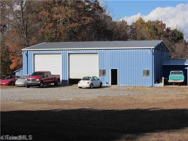 1853 Amostown Road Sandy Ridge, NC 27046 - Photo 4 of 16 Workshop. 50X60 ft Workshop/Garage with 10,000LB auto lift/compressor, full bath, (2) 12 X 14 ft doors.Lots of parking.