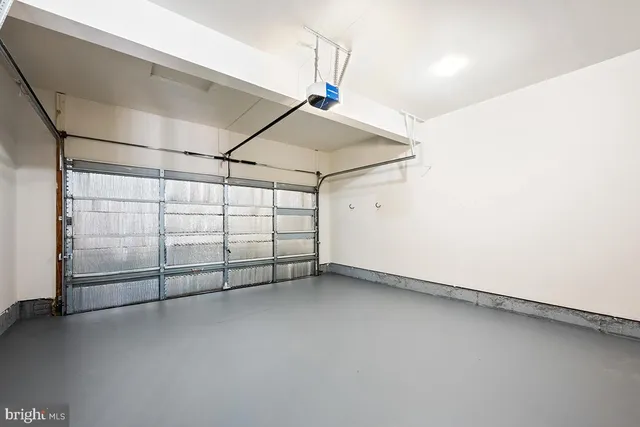 a kitchen with stainless steel appliances granite countertop a refrigerator a stove a sink and a wooden floors