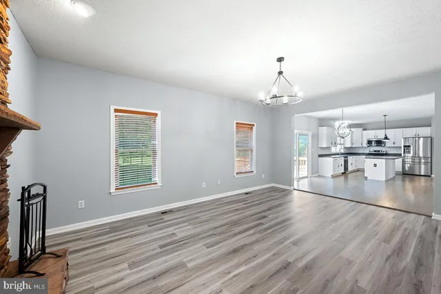 a view of a backyard with sitting area