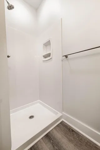 a view of wooden floor in an empty room