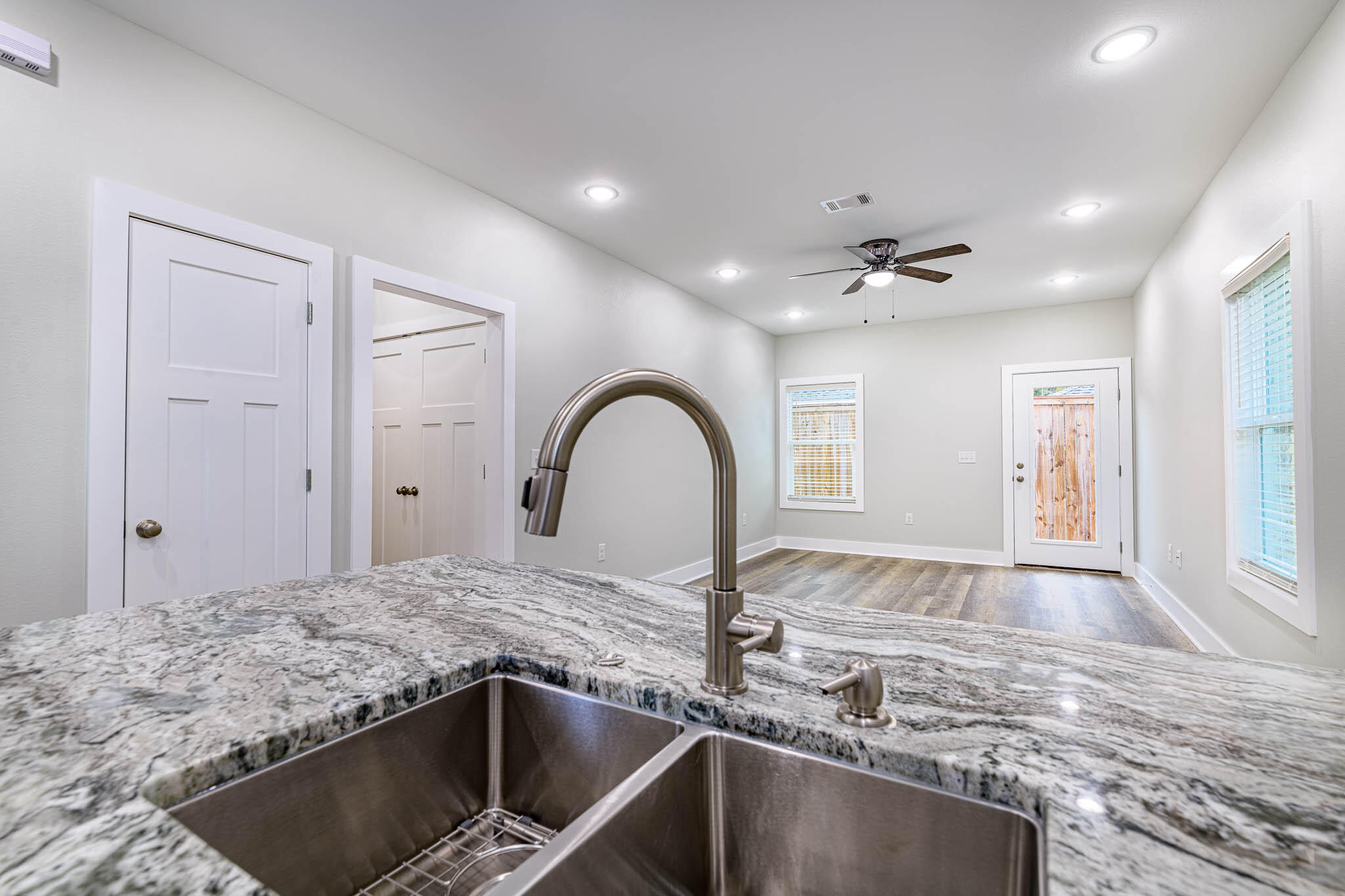 104 Clearing Way Valparaiso, FL 32580 - Photo 5 of 22 a kitchen with granite countertop a sink and a stove