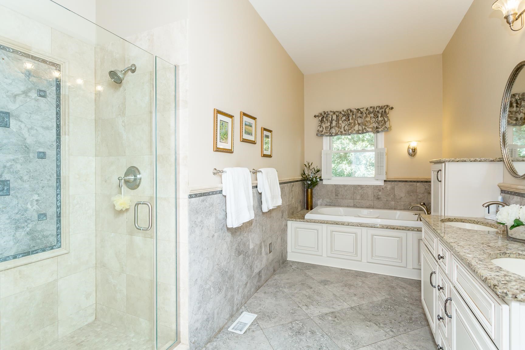 6403 Spring Hill Road Bridgewater, VA 22812 - Photo 28 of 52 a bathroom with a granite countertop bathtub shower sink and mirror