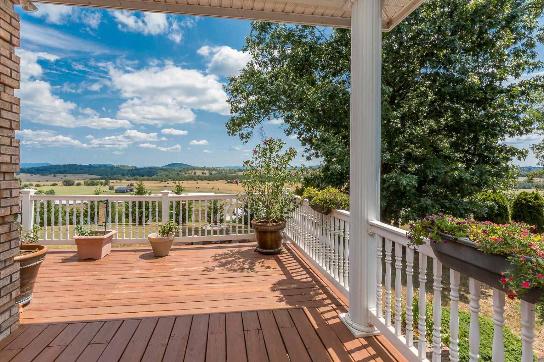 6403 Spring Hill Road Bridgewater, VA 22812 - Photo 6 of 52 a balcony with wooden floor and city view