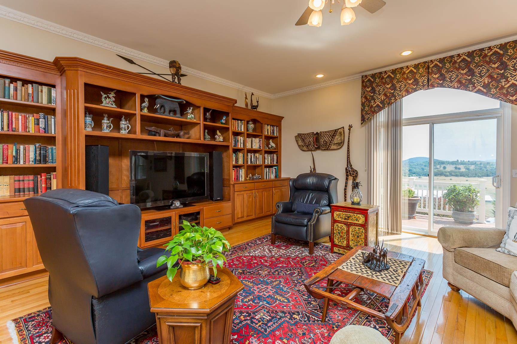 6403 Spring Hill Road Bridgewater, VA 22812 - Photo 10 of 52 a living room with furniture a rug and a flat screen tv