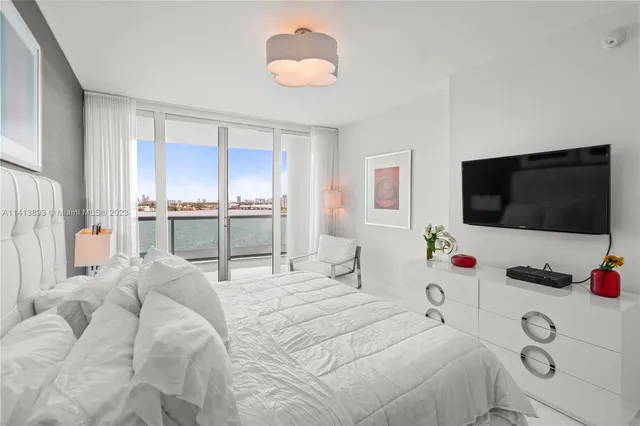 a bathroom with a double vanity sink mirror and shower