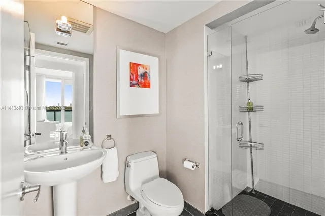 a aerial view of a house with outdoor space lake view and lake view