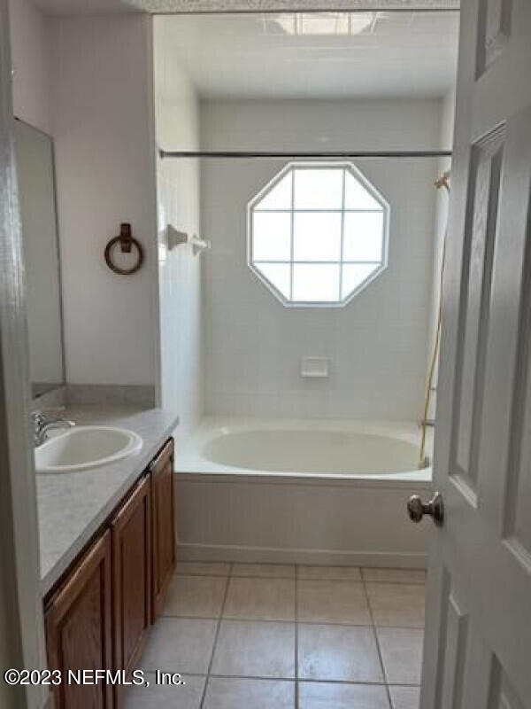 2805 Unison Court Middleburg, FL 32068 - Photo 6 of 6 a bathroom with a sink and a mirror