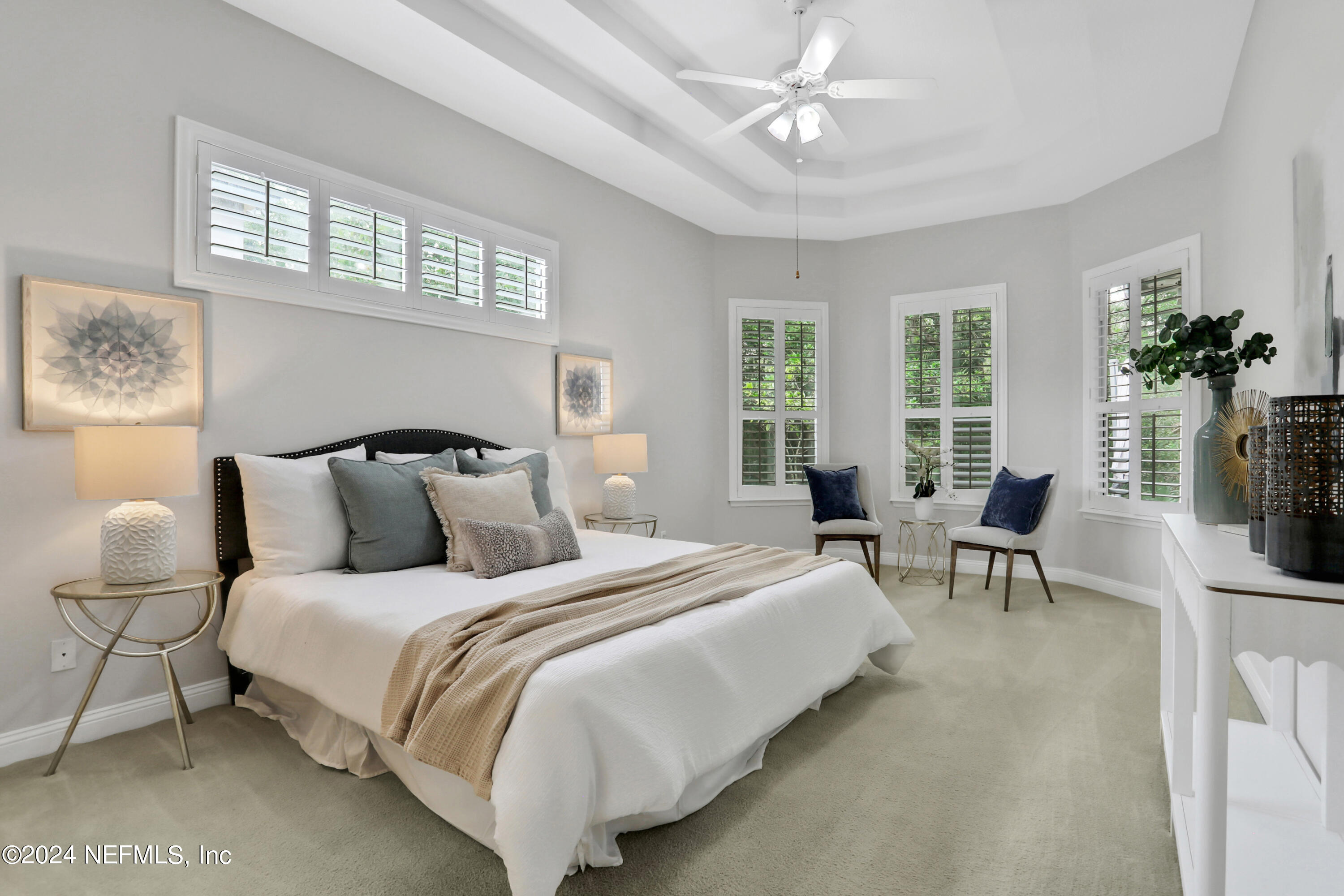 14566 Marsh View Drive Jacksonville, FL 32250 - Photo 11 of 26 a bedroom with bed and a chandelier