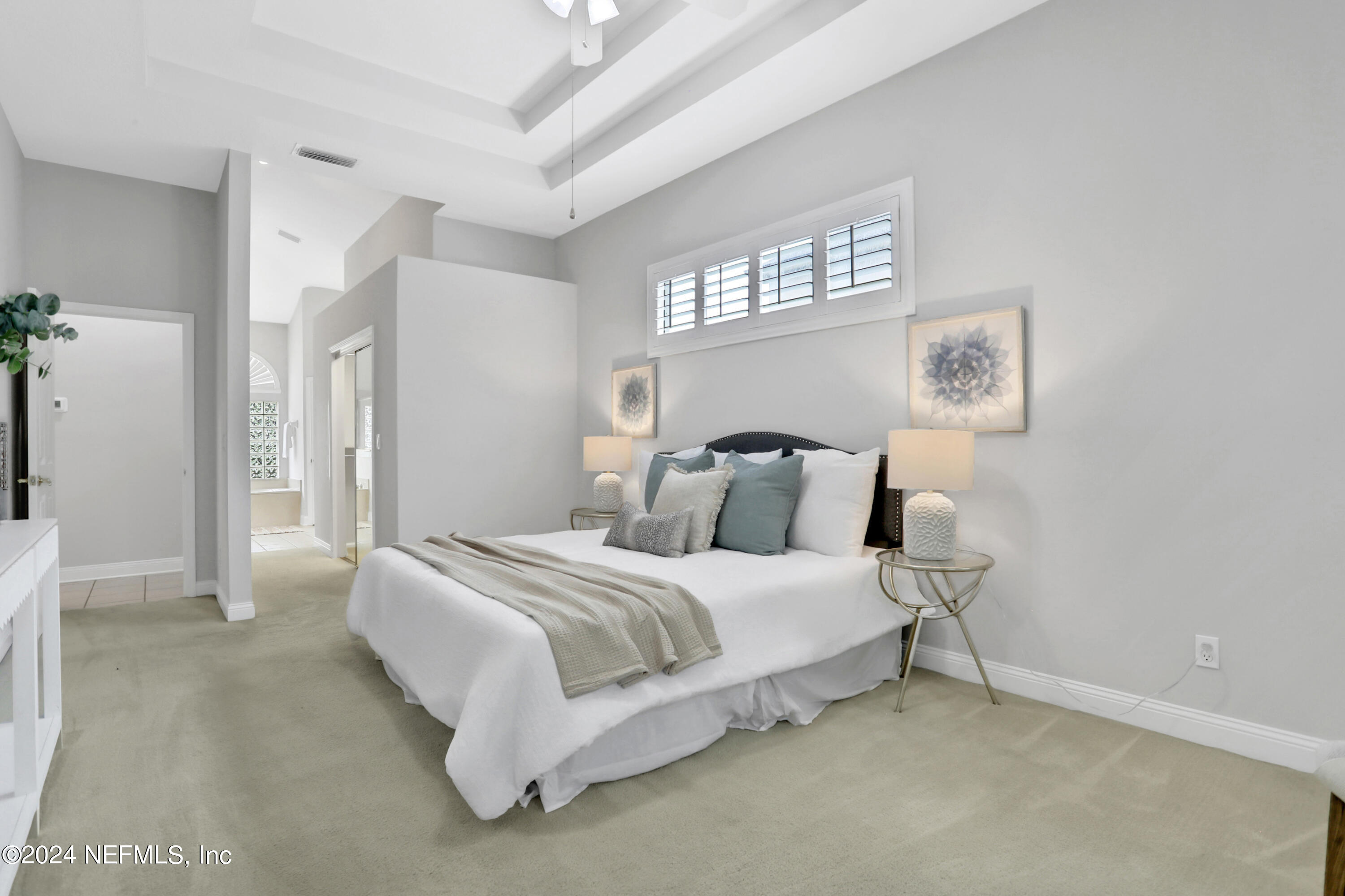 14566 Marsh View Drive Jacksonville, FL 32250 - Photo 12 of 26 a bedroom with a bed and a window