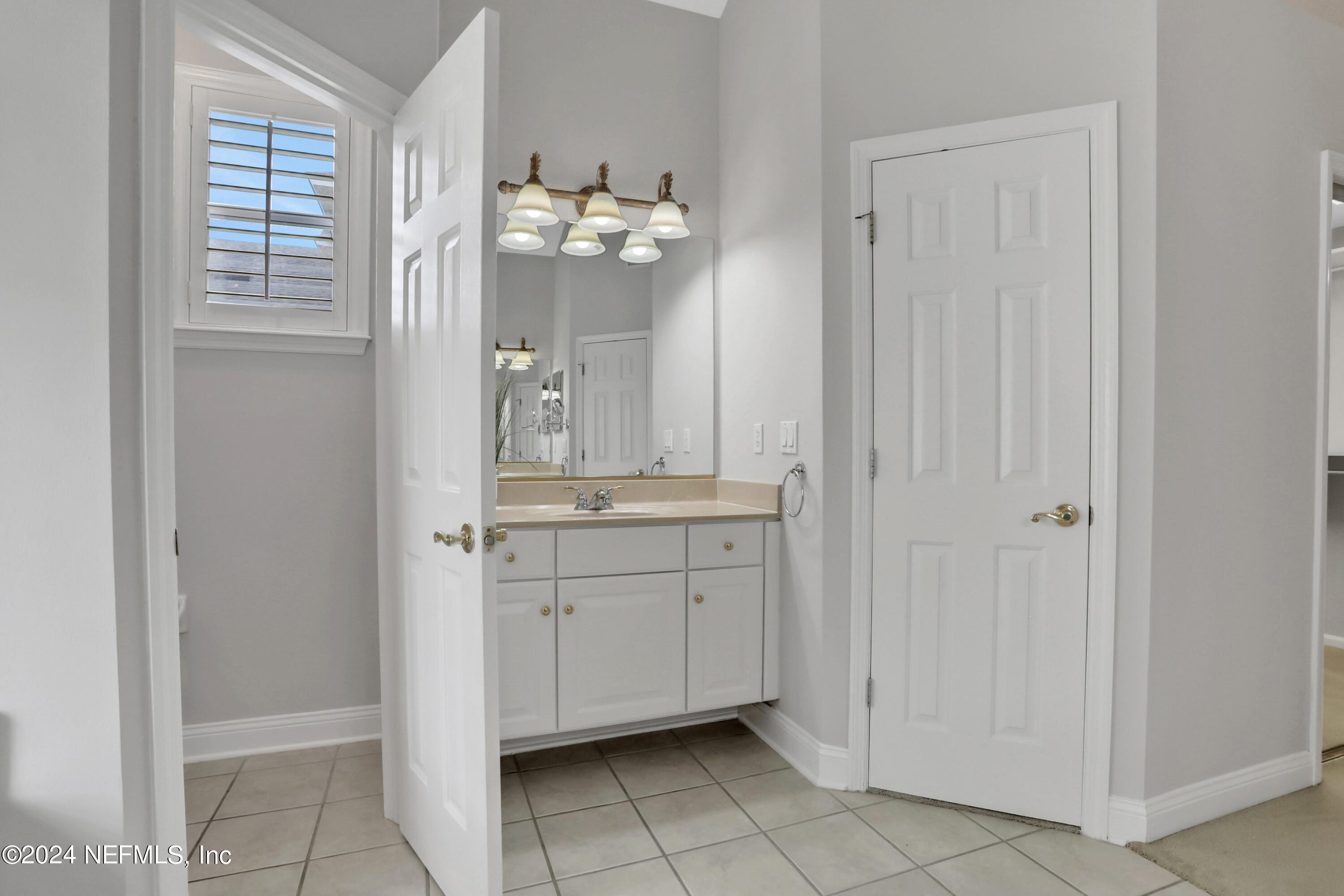 14566 Marsh View Drive Jacksonville, FL 32250 - Photo 14 of 26 a bathroom with a sink shower and a mirror