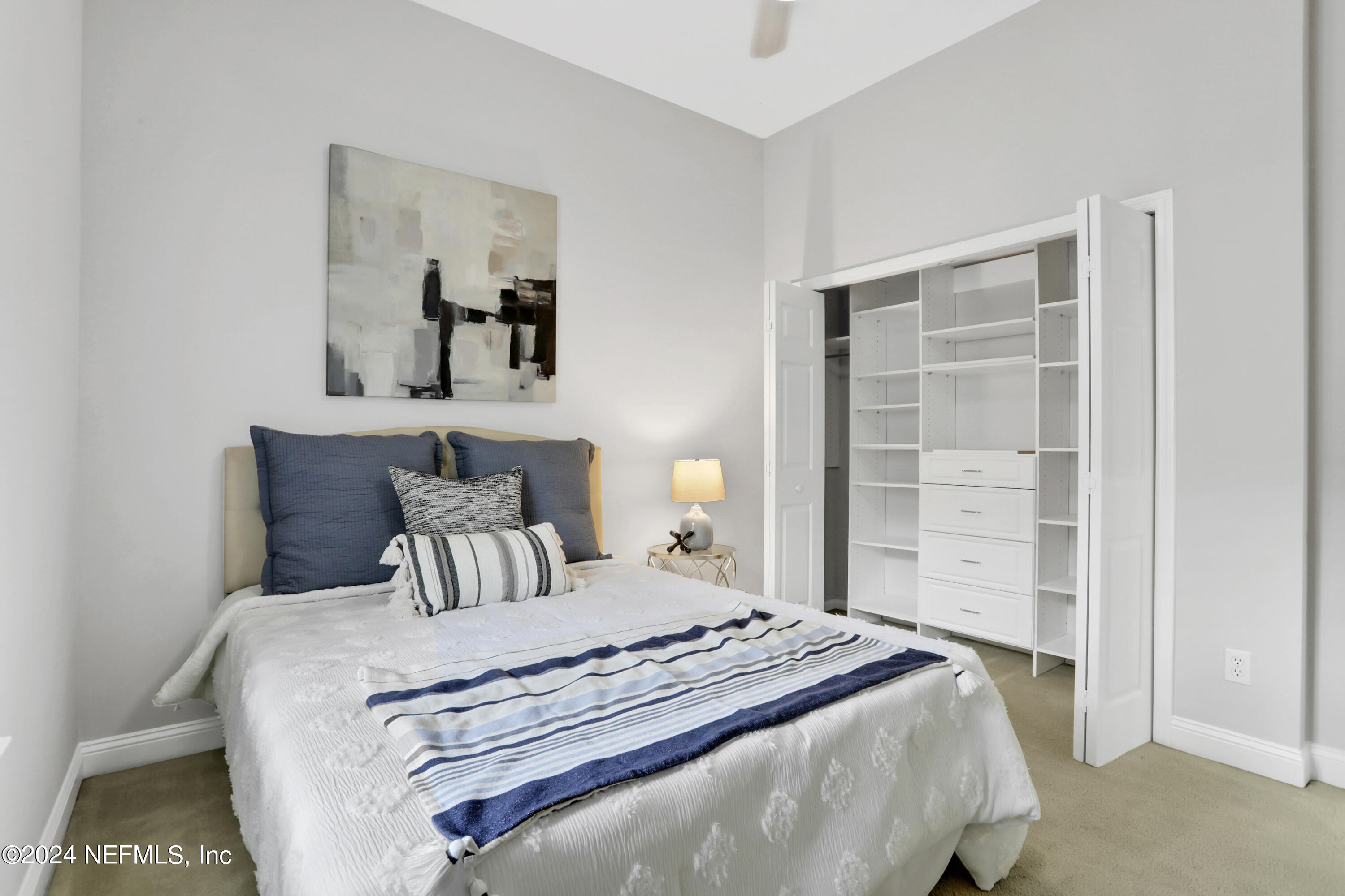 14566 Marsh View Drive Jacksonville, FL 32250 - Photo 17 of 26 a bedroom with a bed and a window