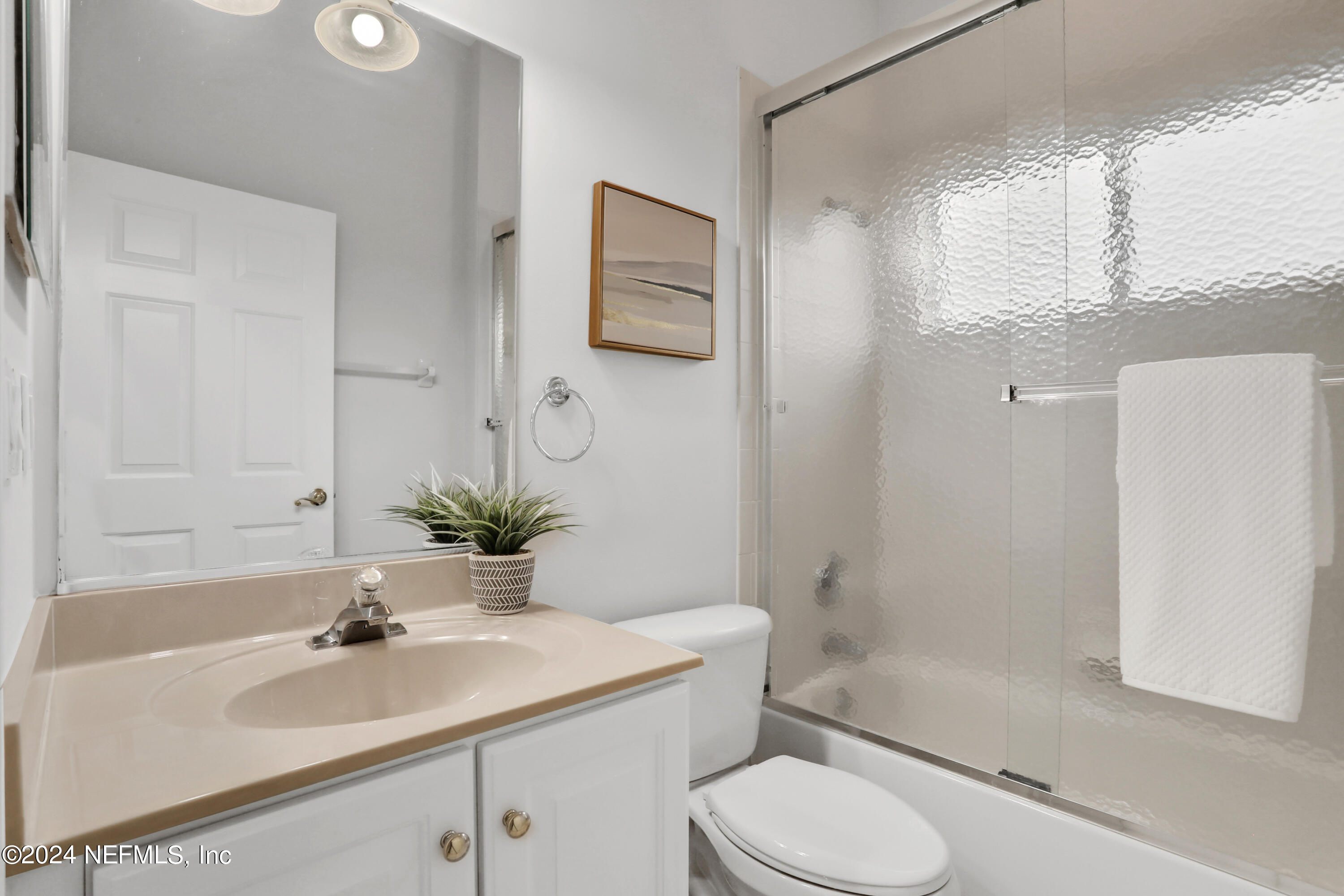 14566 Marsh View Drive Jacksonville, FL 32250 - Photo 19 of 26 a bathroom with a sink toilet and shower