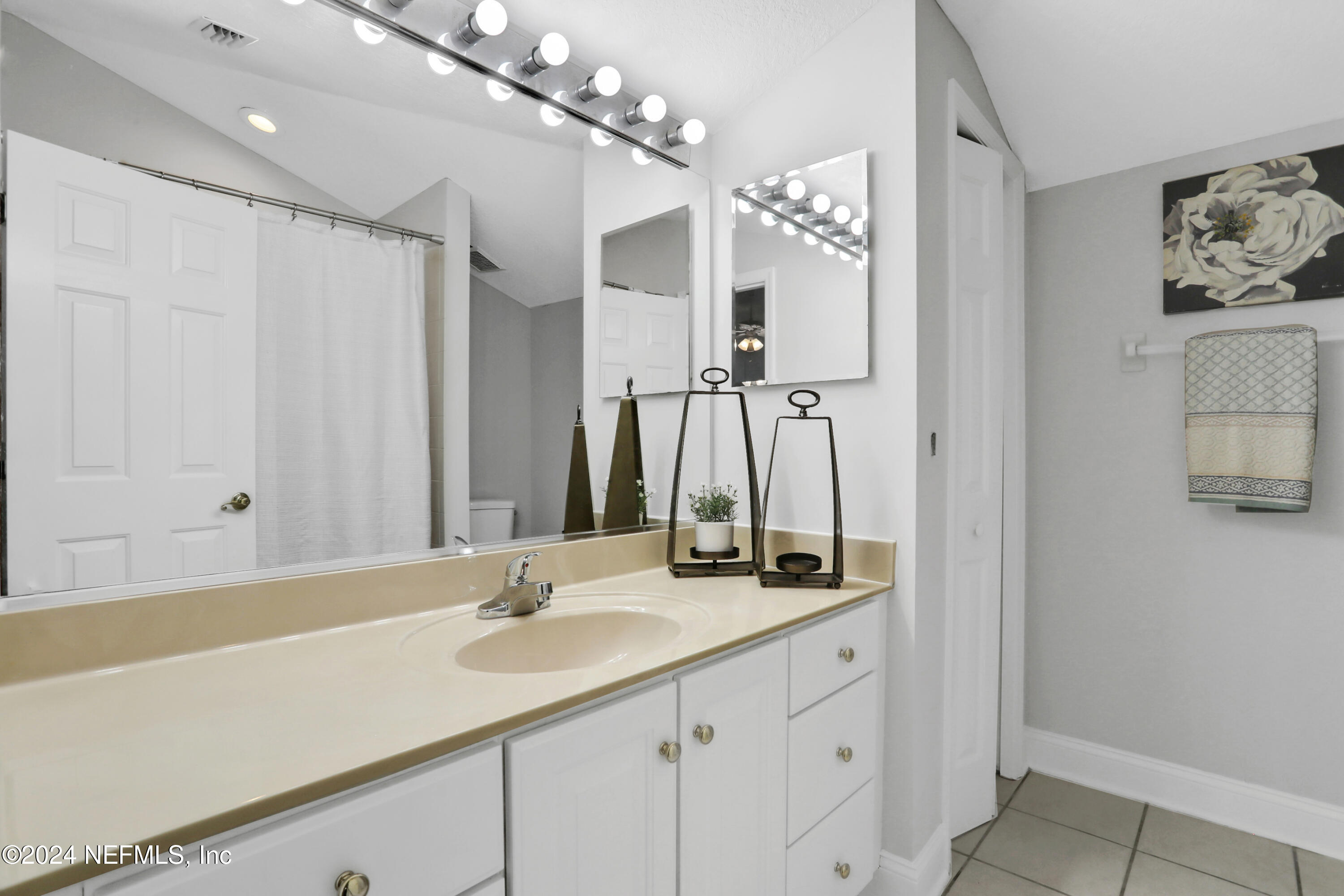 14566 Marsh View Drive Jacksonville, FL 32250 - Photo 22 of 26 a bathroom with a double vanity sink mirror and double