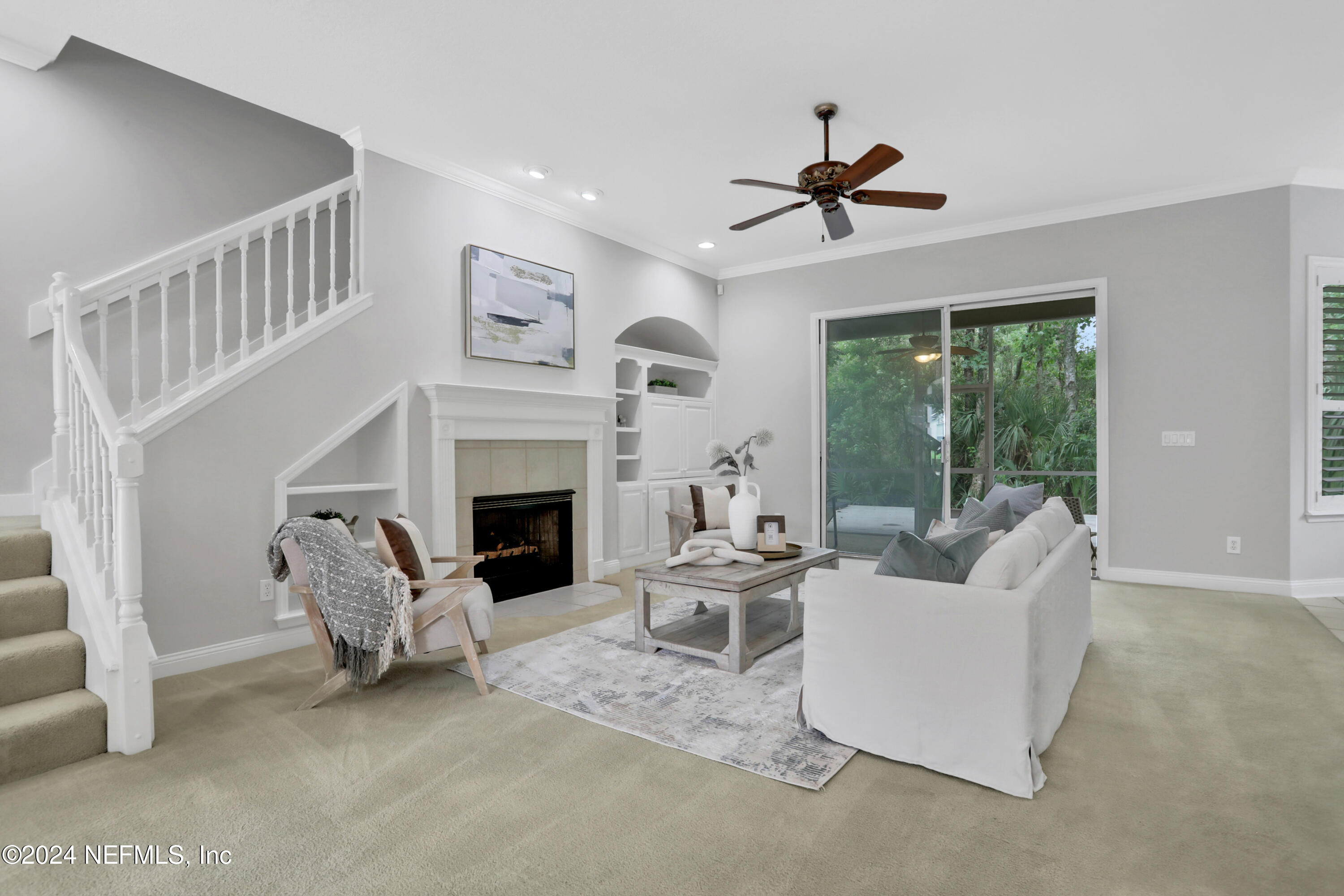 14566 Marsh View Drive Jacksonville, FL 32250 - Photo 4 of 26 a living room with furniture and a fireplace