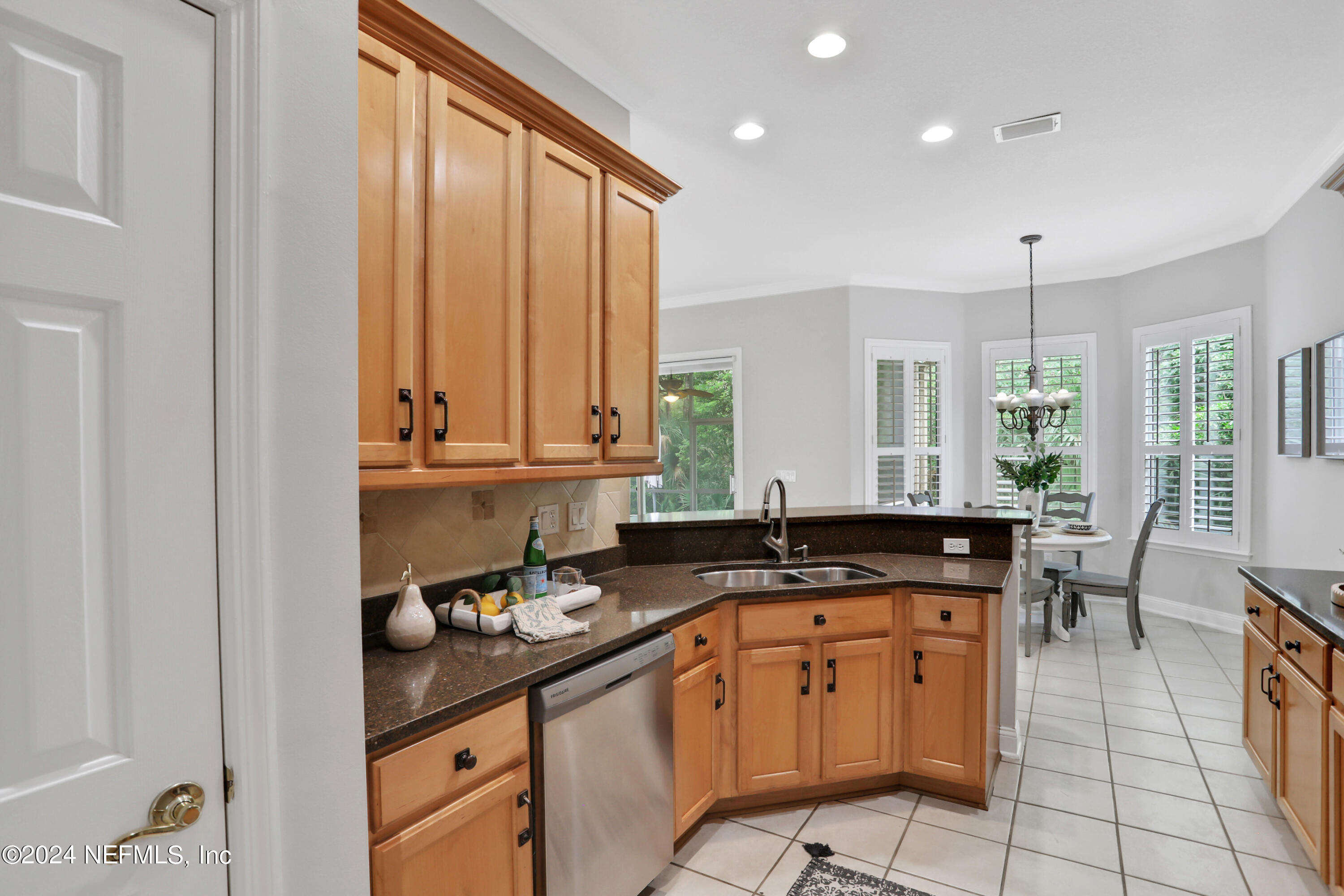 14566 Marsh View Drive Jacksonville, FL 32250 - Photo 6 of 26 a kitchen with stainless steel appliances granite countertop a sink and cabinets