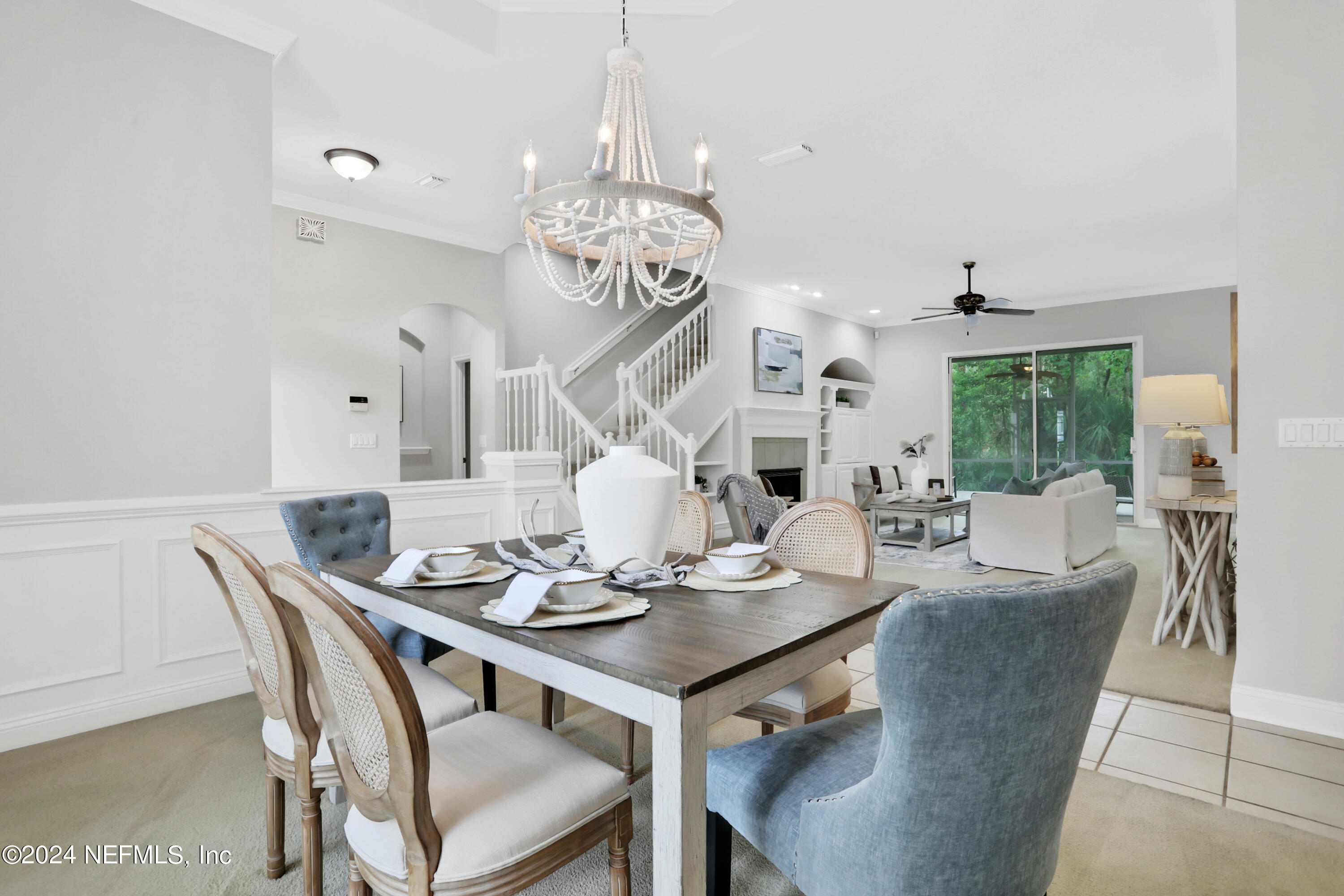 14566 Marsh View Drive Jacksonville, FL 32250 - Photo 10 of 26 a view of a dining room with furniture a chandelier and wooden floor