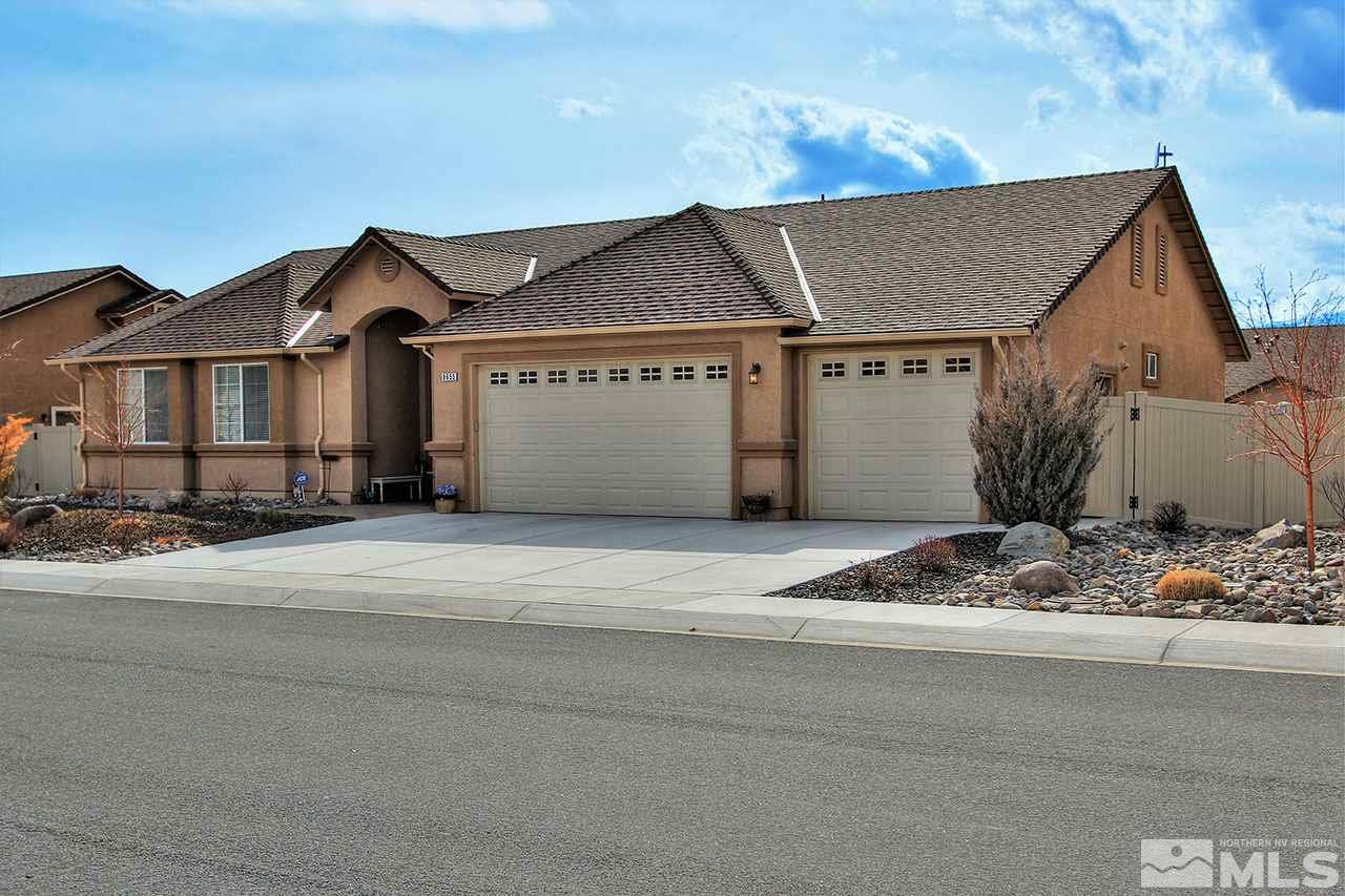 9655 Aidan Way Reno, NV 89521 - Photo 3 of 25 a front view of a house with a yard