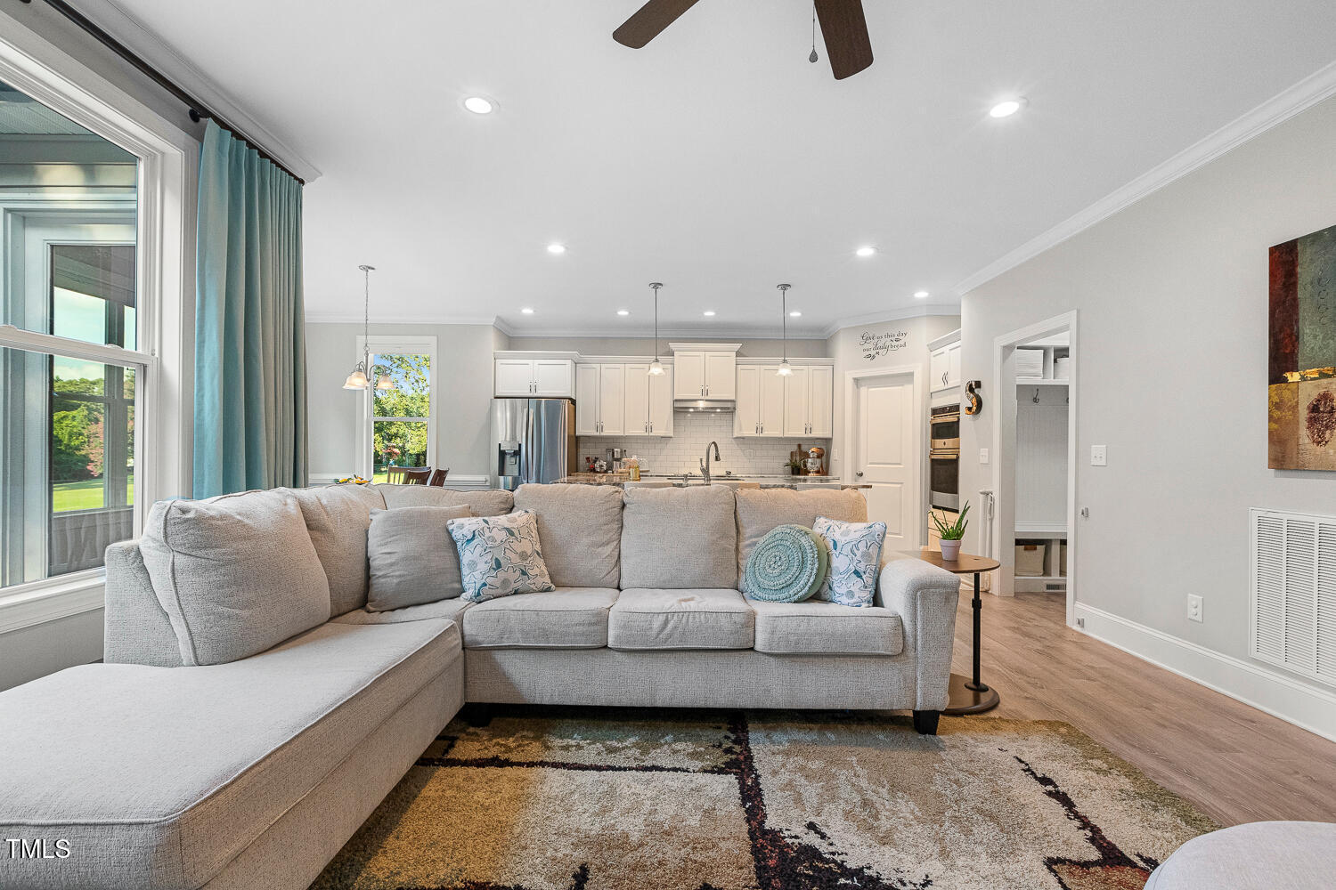 830 Wilbon Road Holly Springs, NC 27540 - Photo 11 of 60 a living room with furniture and a large window