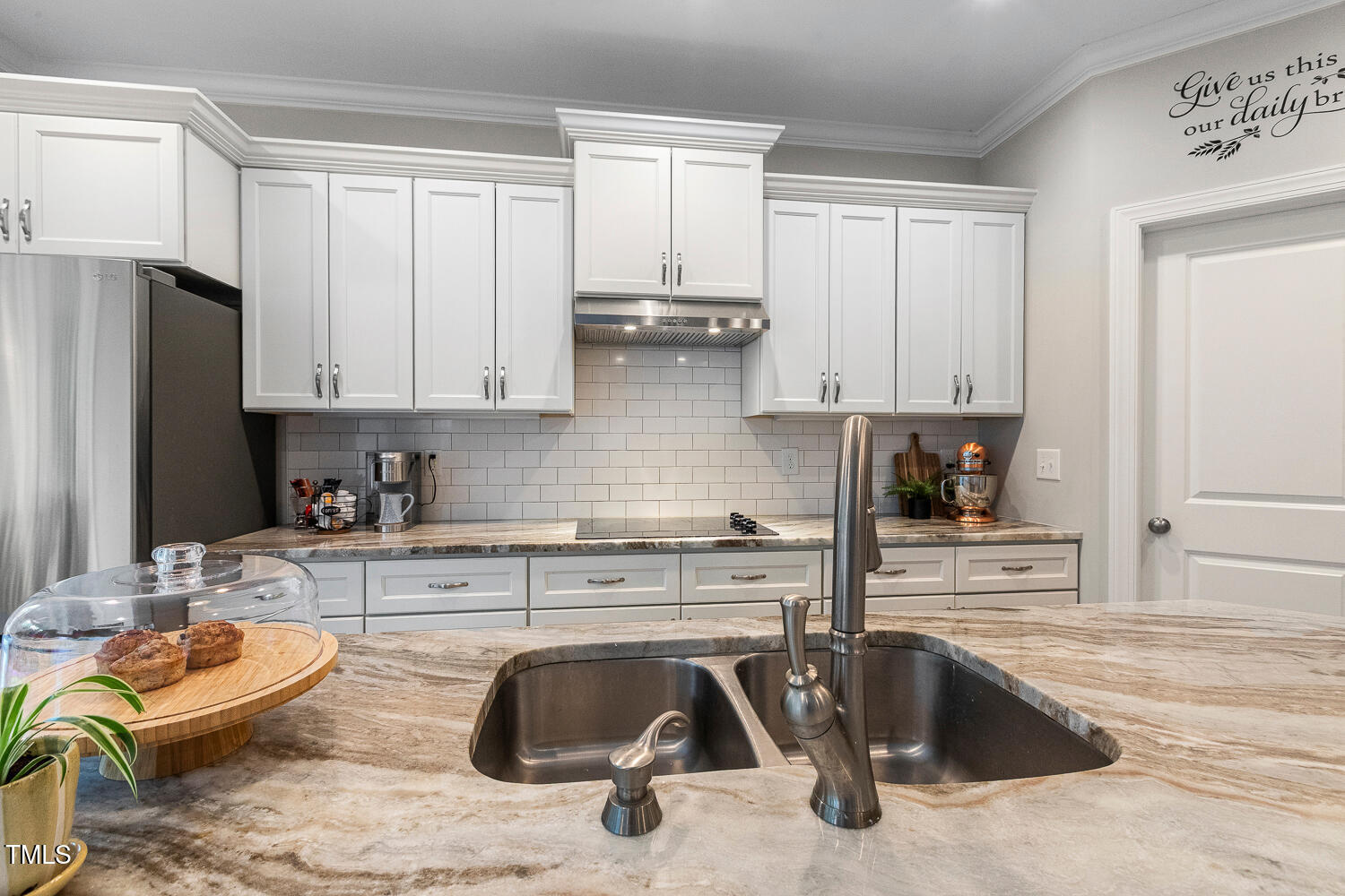 830 Wilbon Road Holly Springs, NC 27540 - Photo 15 of 60 a kitchen with stainless steel appliances granite countertop a sink stove and refrigerator