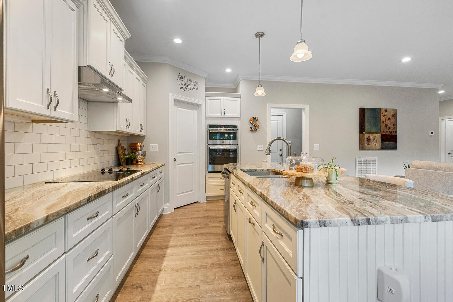 830 Wilbon Road Holly Springs, NC 27540 - Photo 17 of 60 a large kitchen with stainless steel appliances granite countertop a sink and cabinets