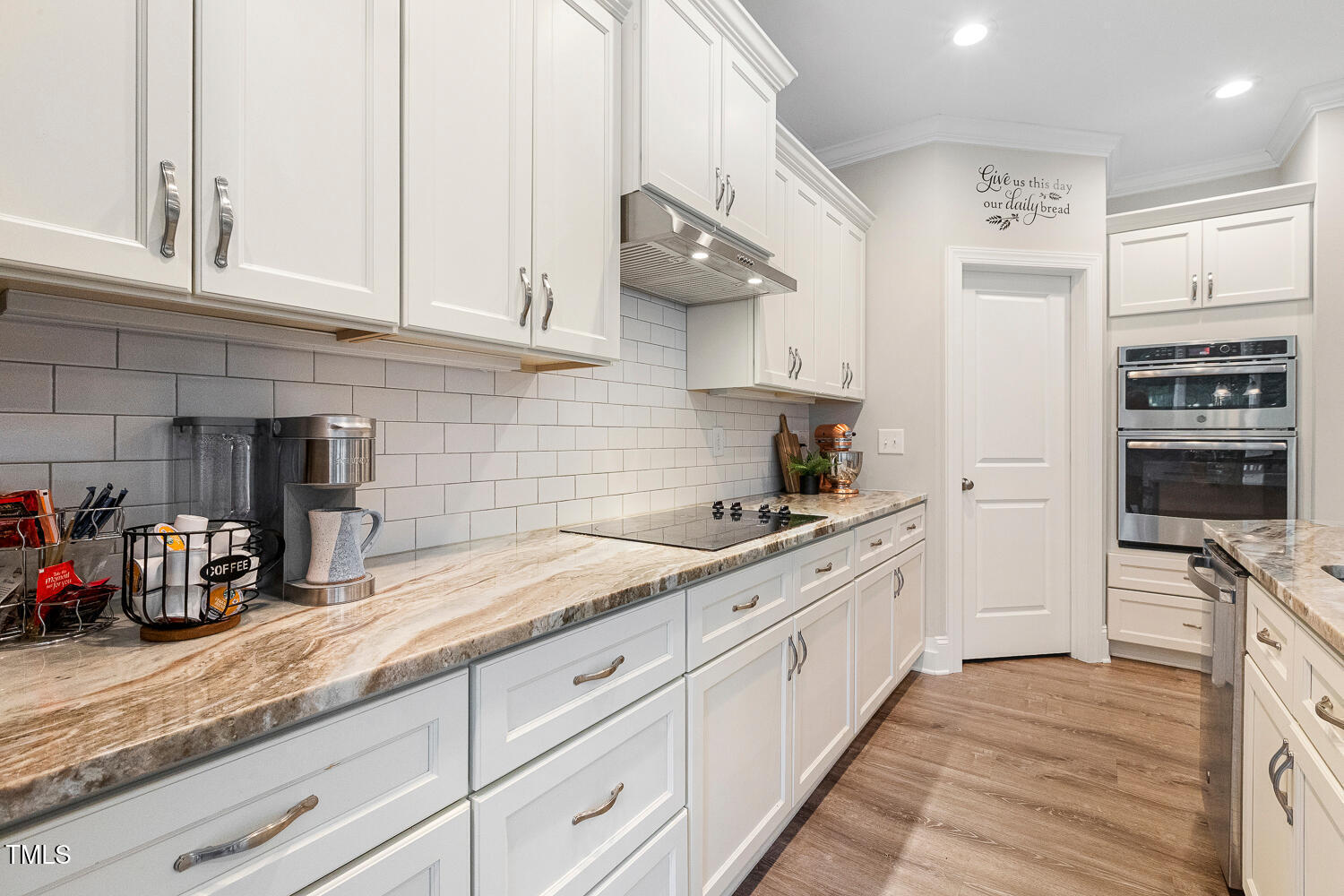 830 Wilbon Road Holly Springs, NC 27540 - Photo 18 of 60 a kitchen with stainless steel appliances granite countertop a sink and cabinets