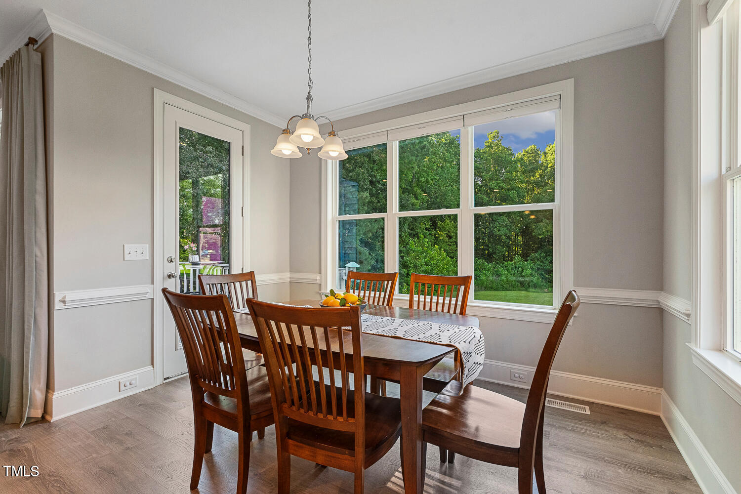 830 Wilbon Road Holly Springs, NC 27540 - Photo 21 of 60 a view of a dining room with furniture window and outside view