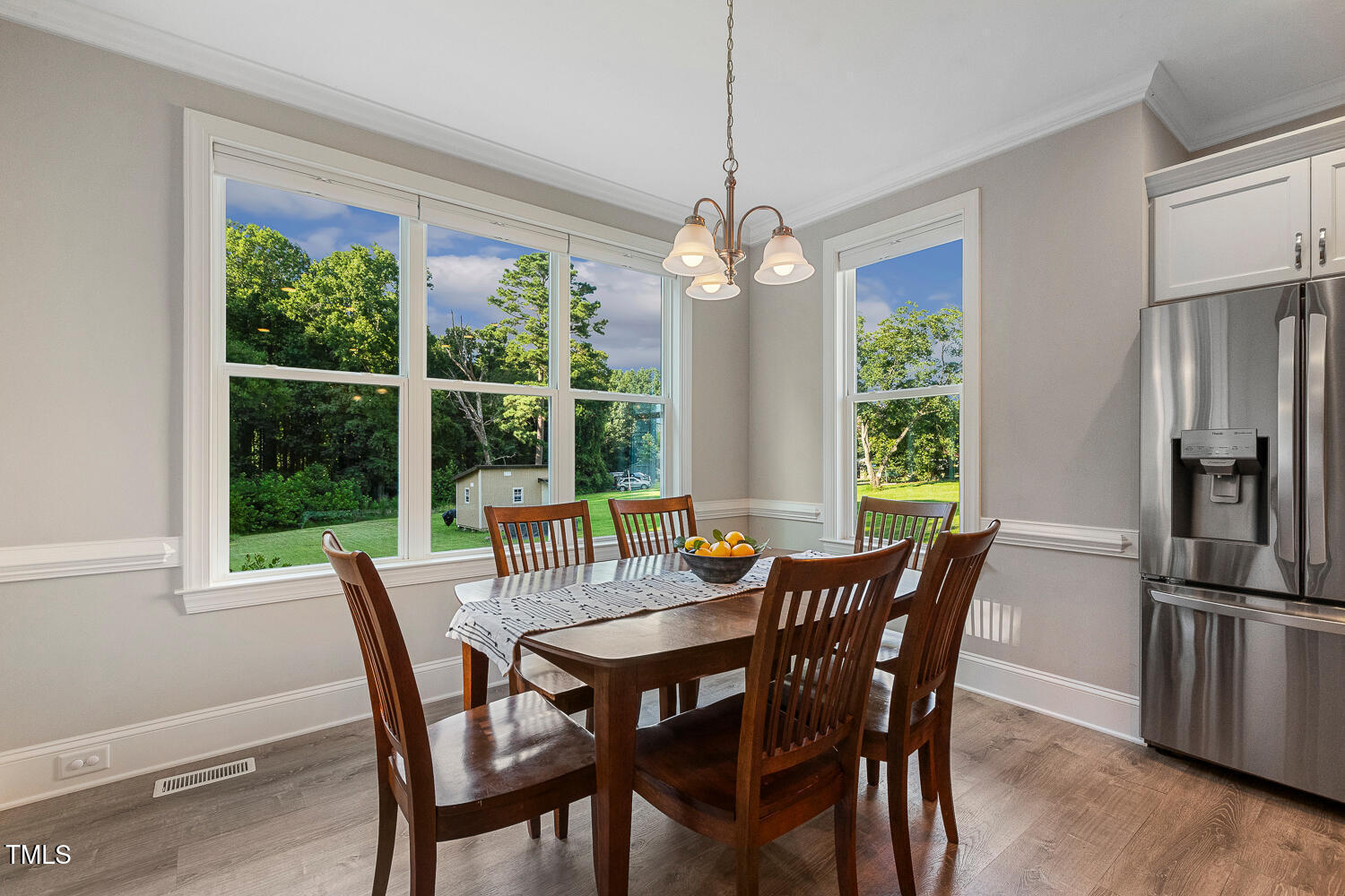 830 Wilbon Road Holly Springs, NC 27540 - Photo 22 of 60 a view of a dining room with furniture large window and outside view