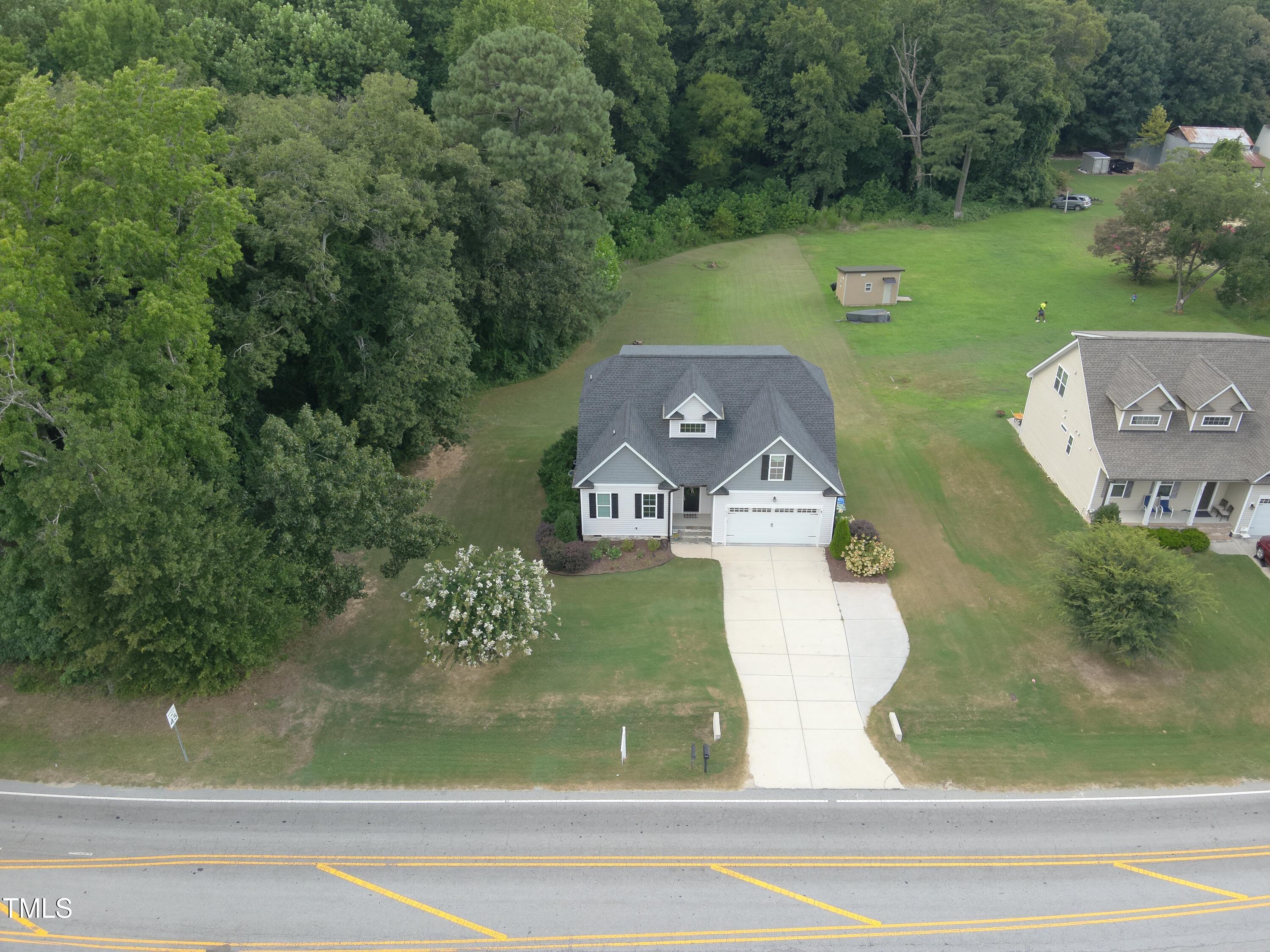 830 Wilbon Road Holly Springs, NC 27540 - Photo 3 of 60 an aerial view of a house