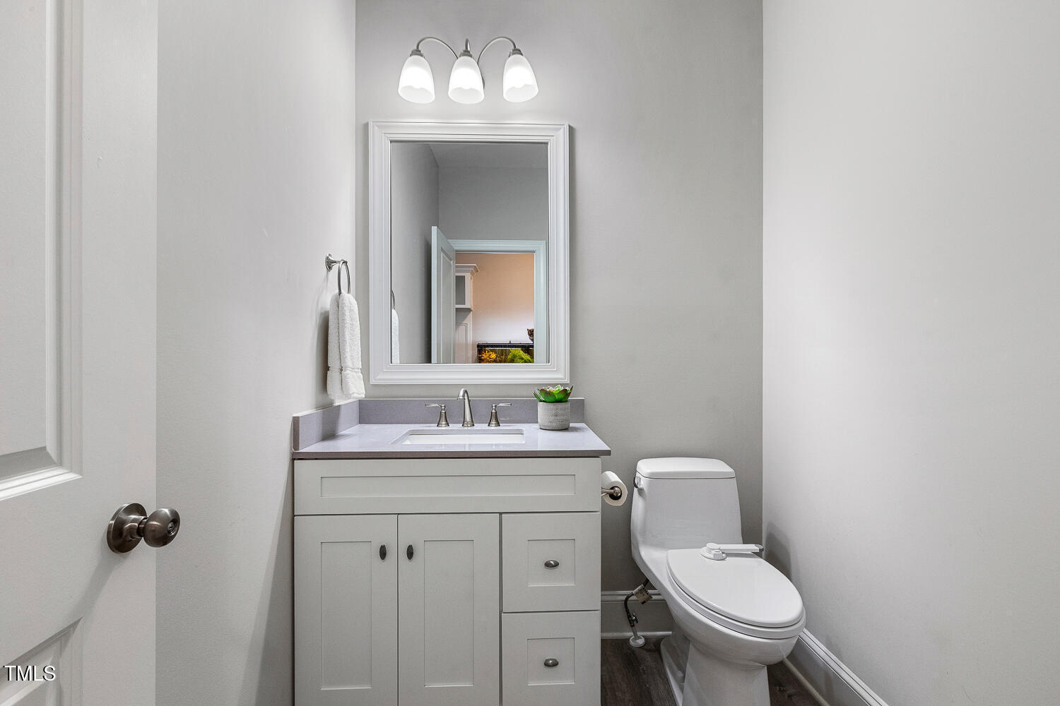 830 Wilbon Road Holly Springs, NC 27540 - Photo 35 of 60 a bathroom with a toilet sink and mirror
