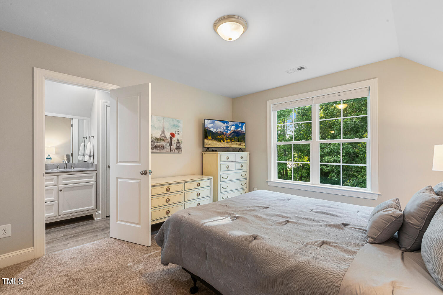 830 Wilbon Road Holly Springs, NC 27540 - Photo 38 of 60 a bedroom with a bed and a large window