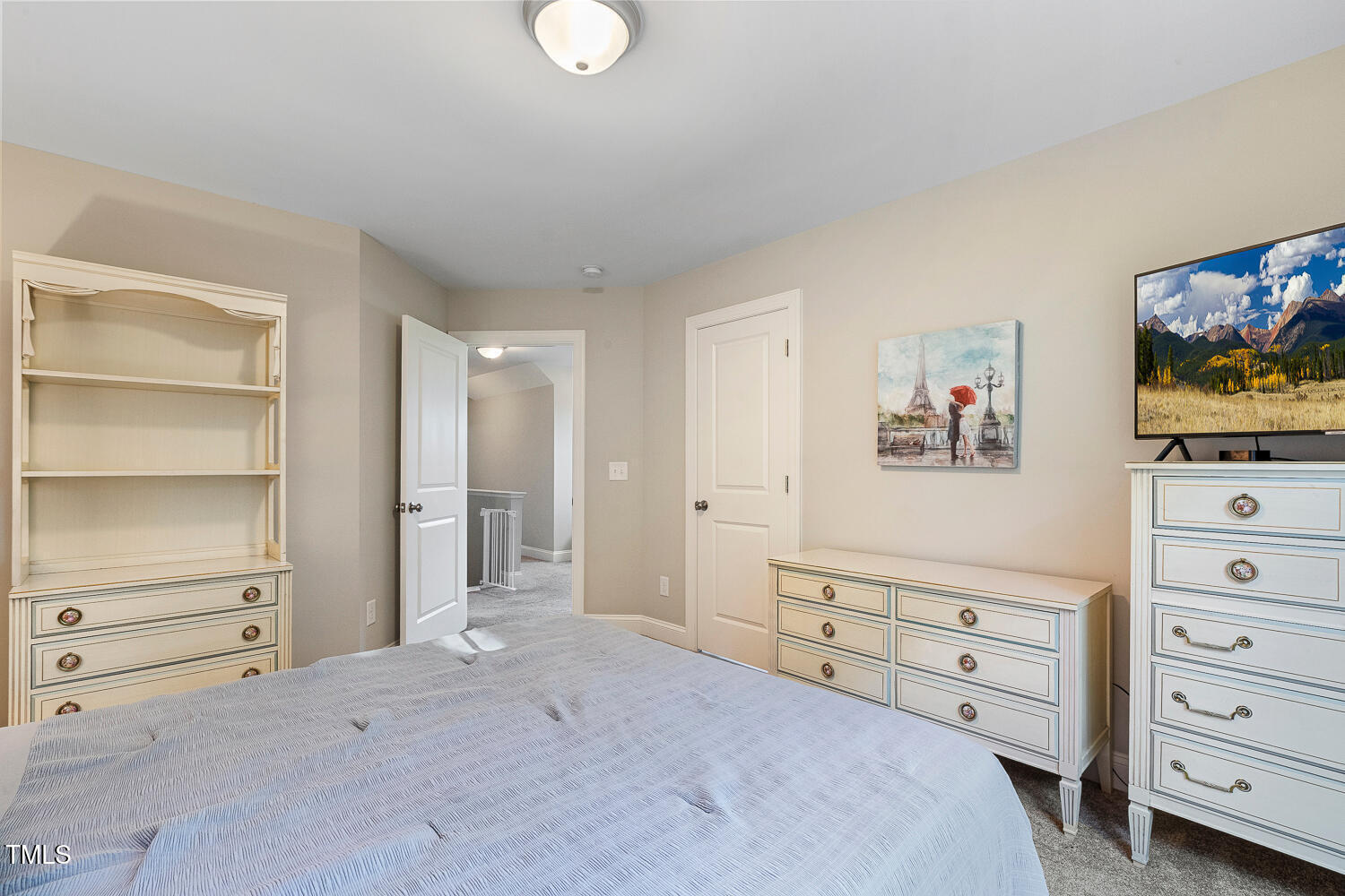 830 Wilbon Road Holly Springs, NC 27540 - Photo 39 of 60 a bedroom with a bed and a television