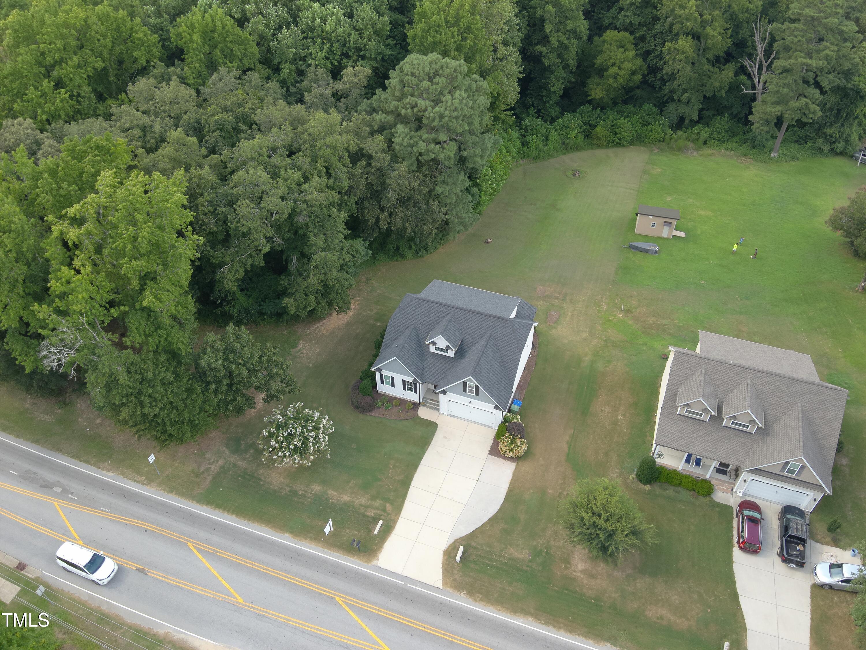 830 Wilbon Road Holly Springs, NC 27540 - Photo 4 of 60 an aerial view of a house with lake view