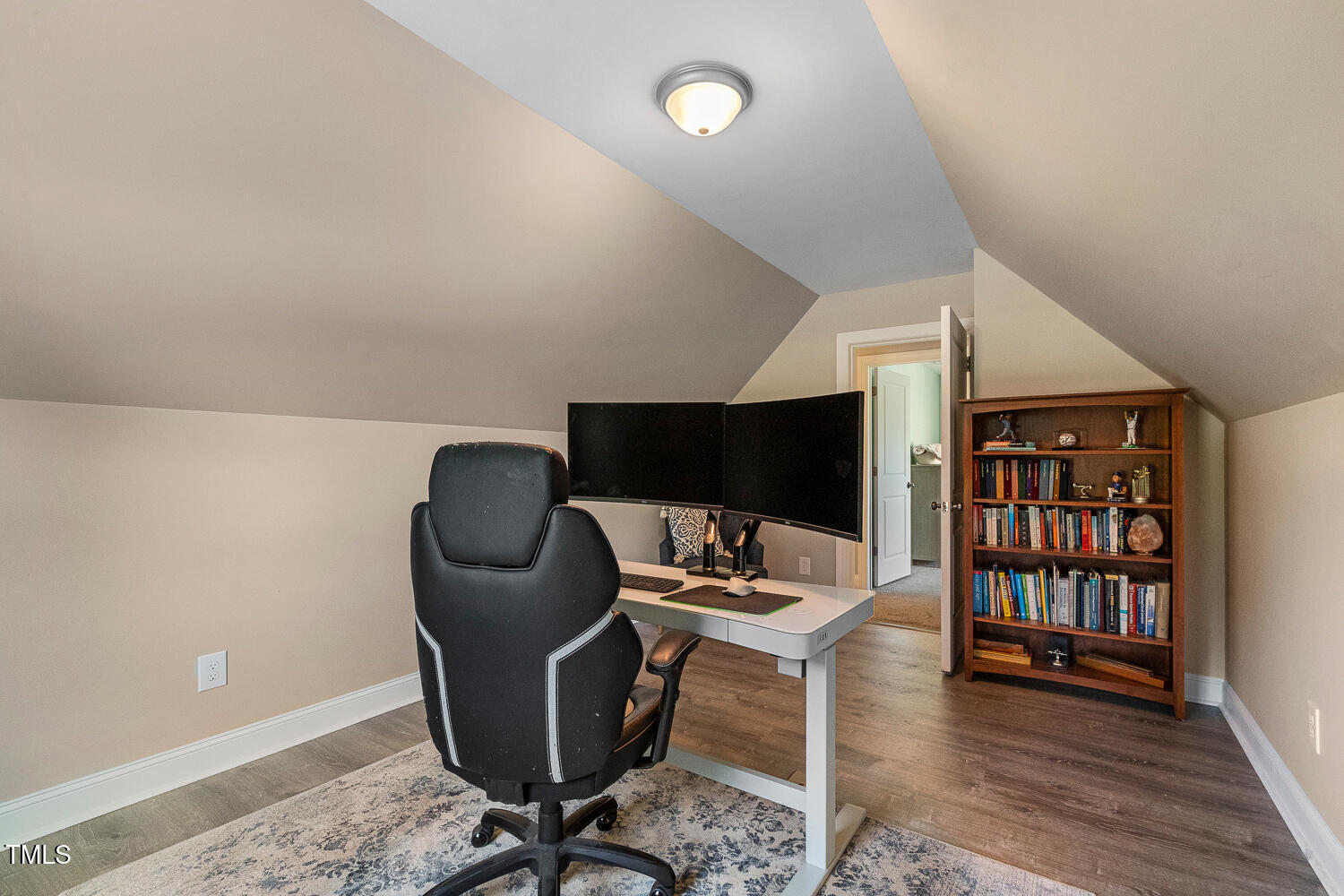 830 Wilbon Road Holly Springs, NC 27540 - Photo 44 of 60 a workspace with furniture wooden floor and window