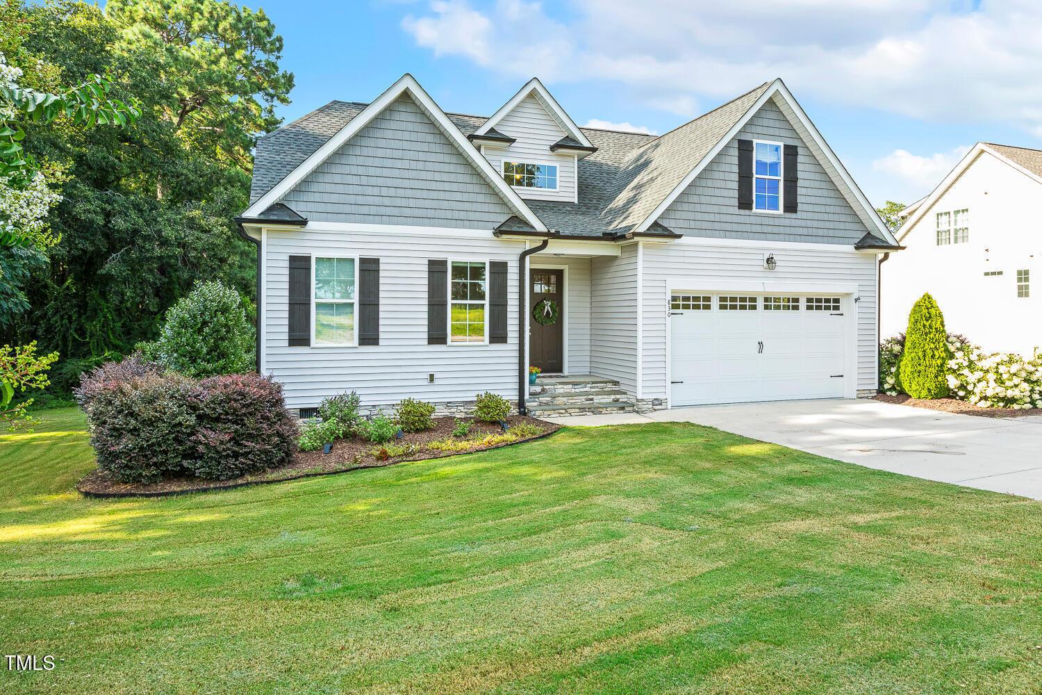 830 Wilbon Road Holly Springs, NC 27540 - Photo 5 of 60 a front view of a house with a yard