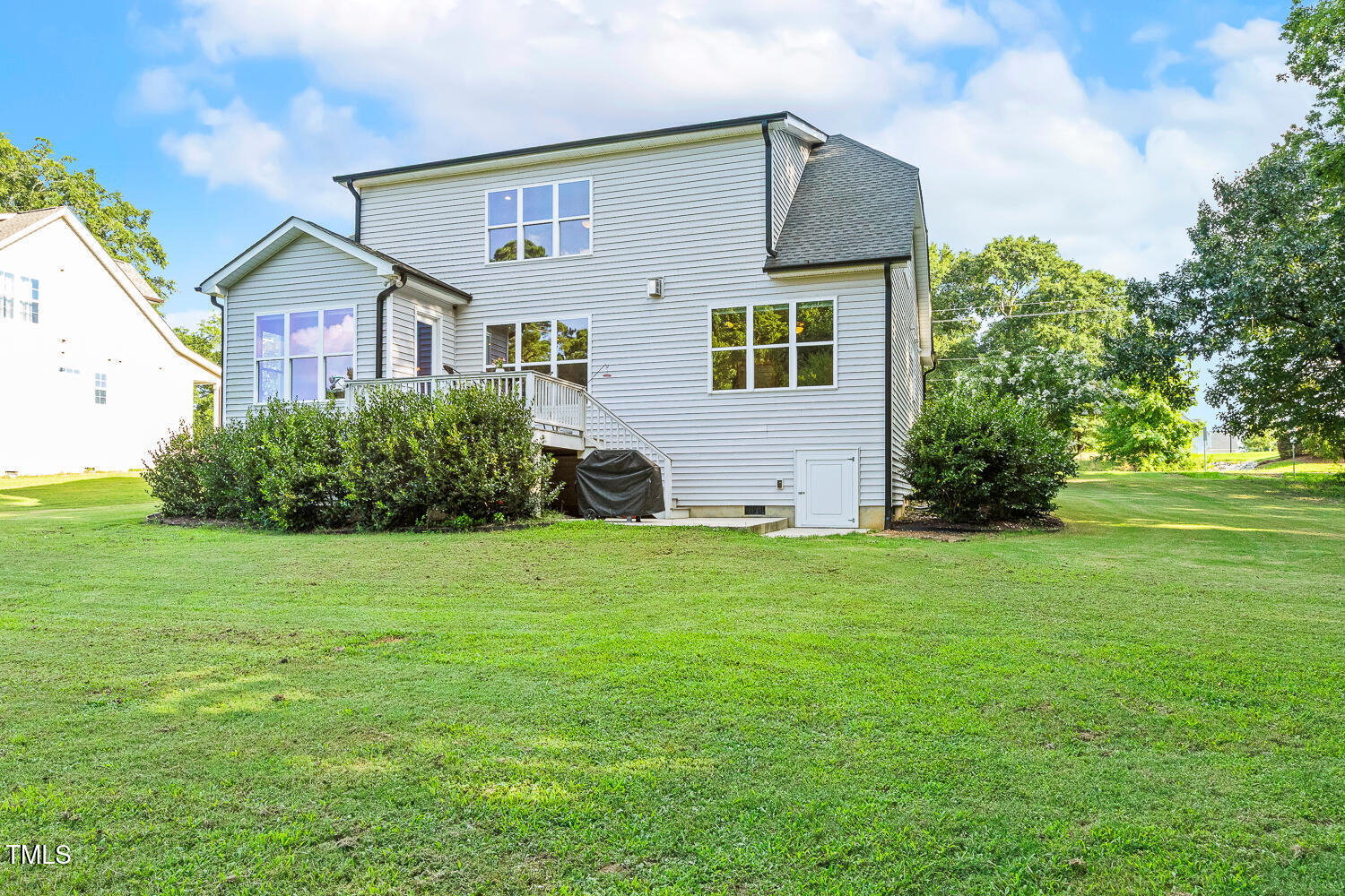 830 Wilbon Road Holly Springs, NC 27540 - Photo 55 of 60 a front view of a house with a garden
