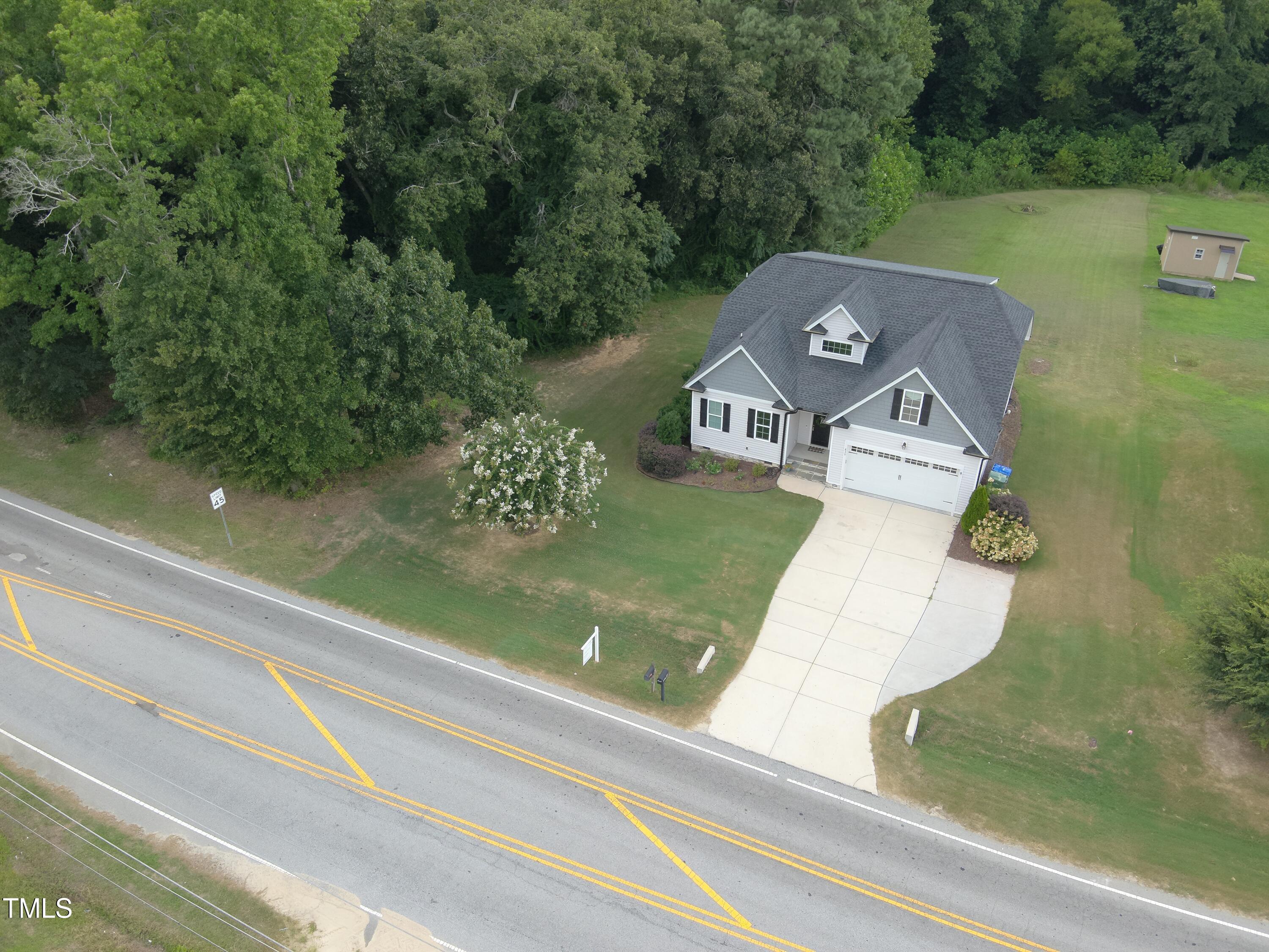 830 Wilbon Road Holly Springs, NC 27540 - Photo 57 of 60 an aerial view of a house with a yard