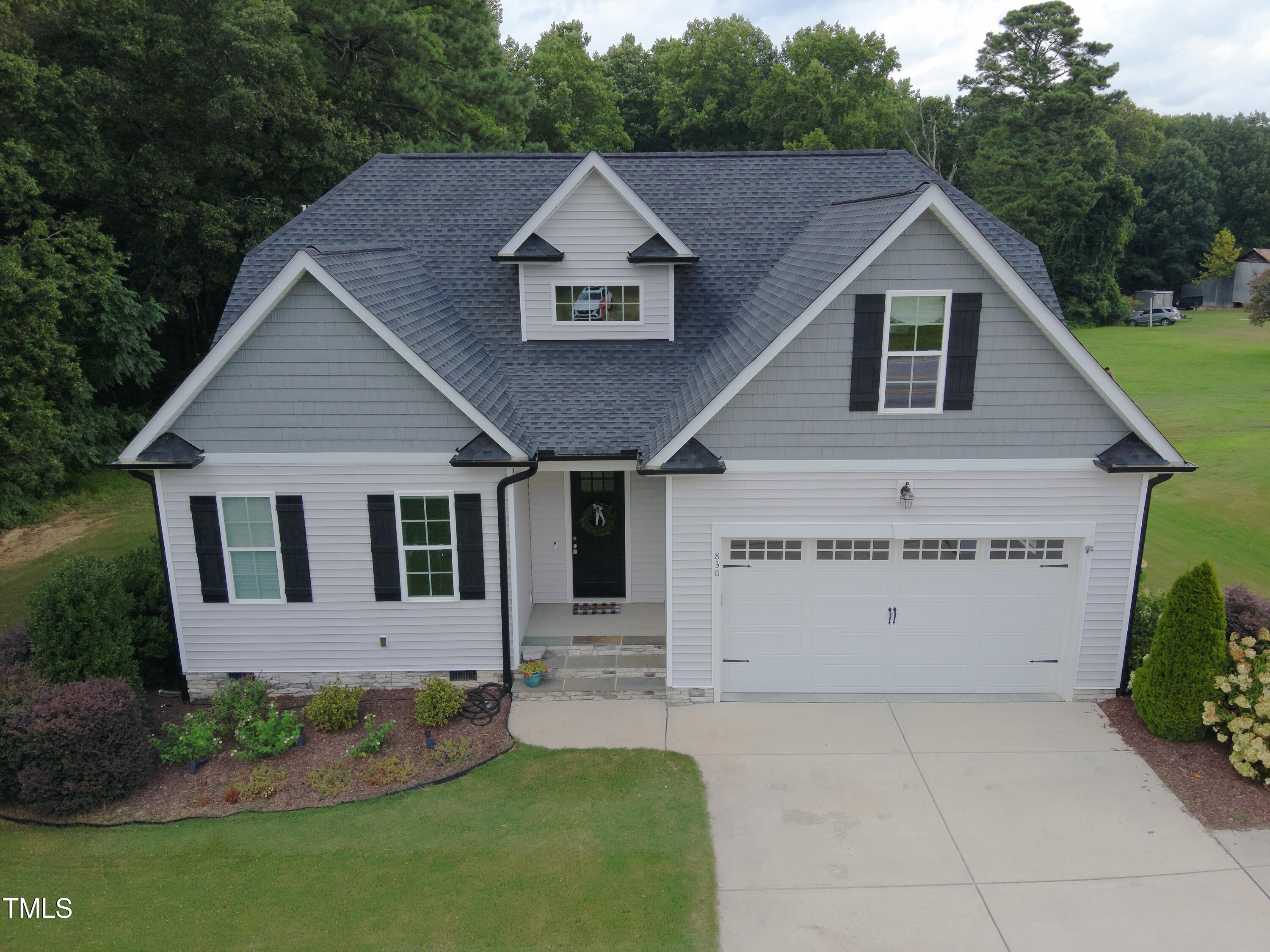 830 Wilbon Road Holly Springs, NC 27540 - Photo 58 of 60 a view of house and garden