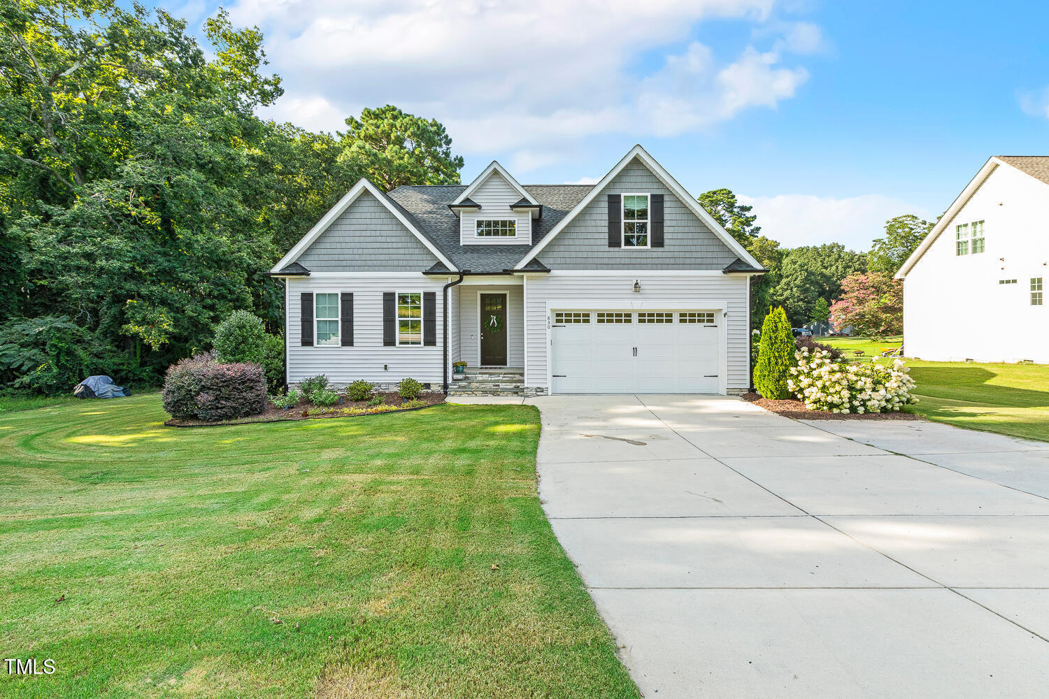 830 Wilbon Road Holly Springs, NC 27540 - Photo 59 of 60 a front view of a house with garden